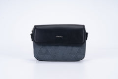 Black women's shoulder bag with a long strap, small size, and elegant design.